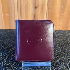 Vintage Cartier woman’s wallet. Burgundy. Excellent condition. Soft leather.